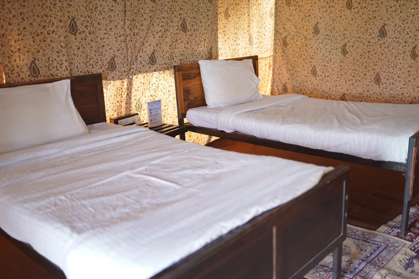 Non-AC Swiss Cottage twin bedroom with paisley walls at Dhordo Tent City