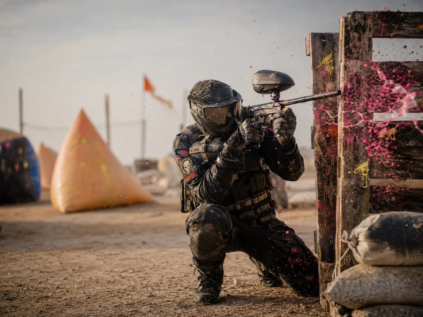 Paintball action in the desert arena at Rann Utsav with players taking cover, Dhordo, Kutch