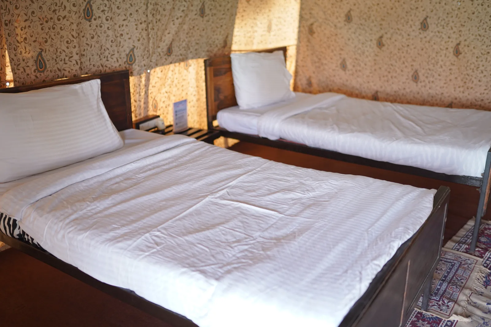 Non-AC Swiss Cottage interior furnishings at Rann Utsav Tent City